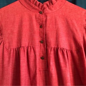 Denim look -cotton/poly blend.pockets, 3/4 sleeves. Small ruffle, buttons, 42”L